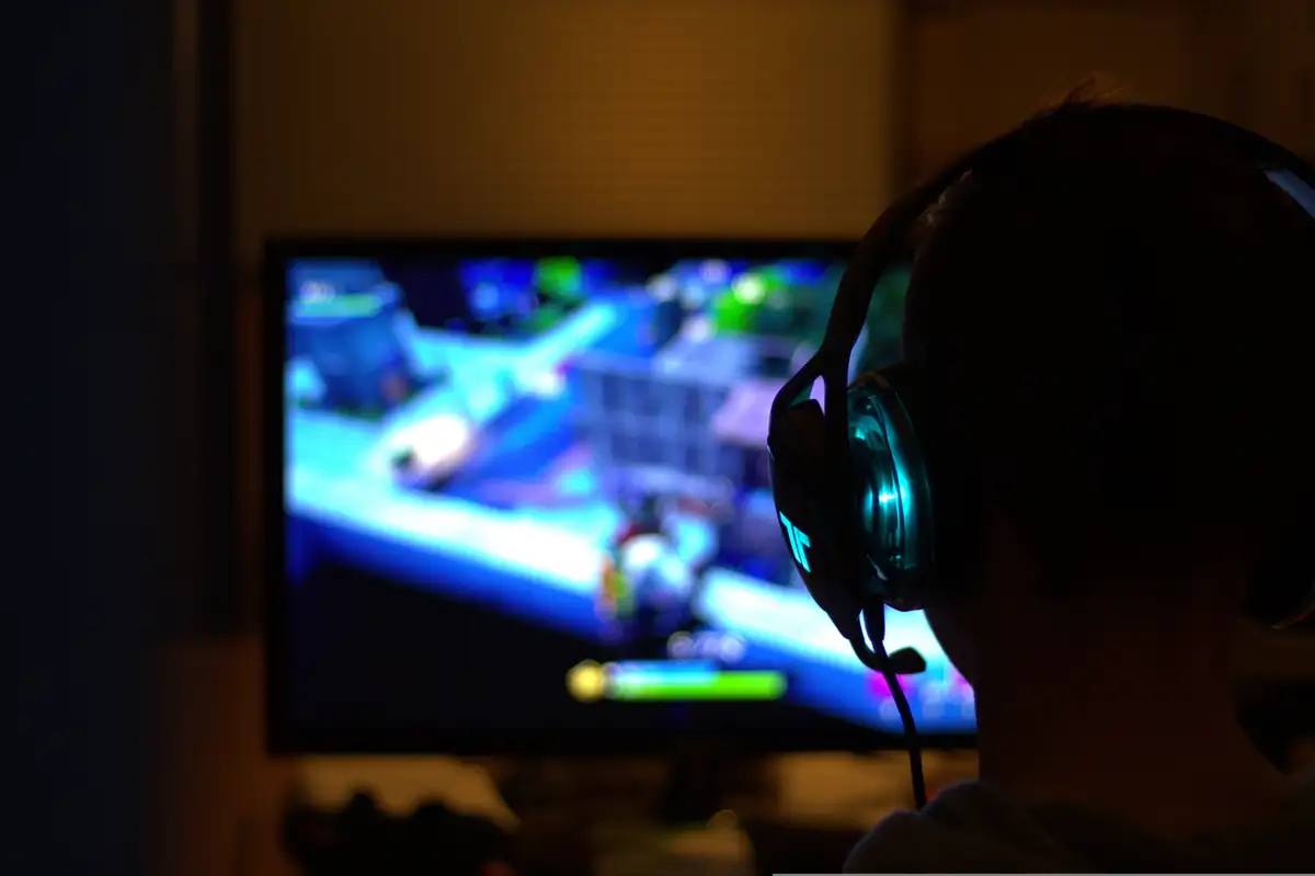 Person playing a video game on a computer