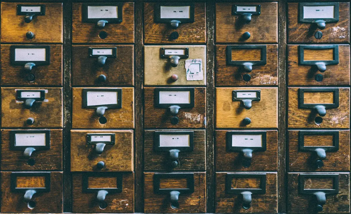 Vintage wooden card catalog with drawers for organizing information
